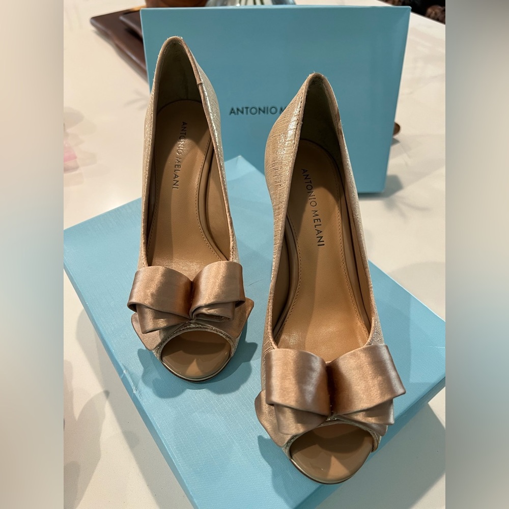 Antonio Melani dress heels.  Worn once-gold like new.  Size 7, fits like an 8